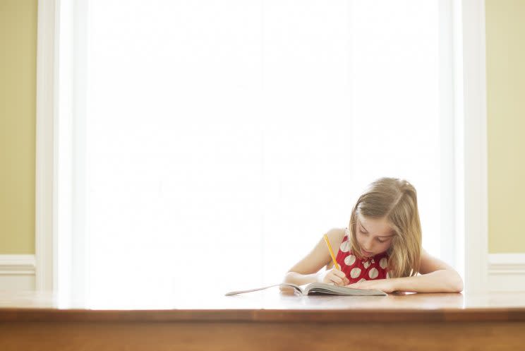 Is homework helping children's learning or an unnecessary burden on parents? [Photo: Getty]