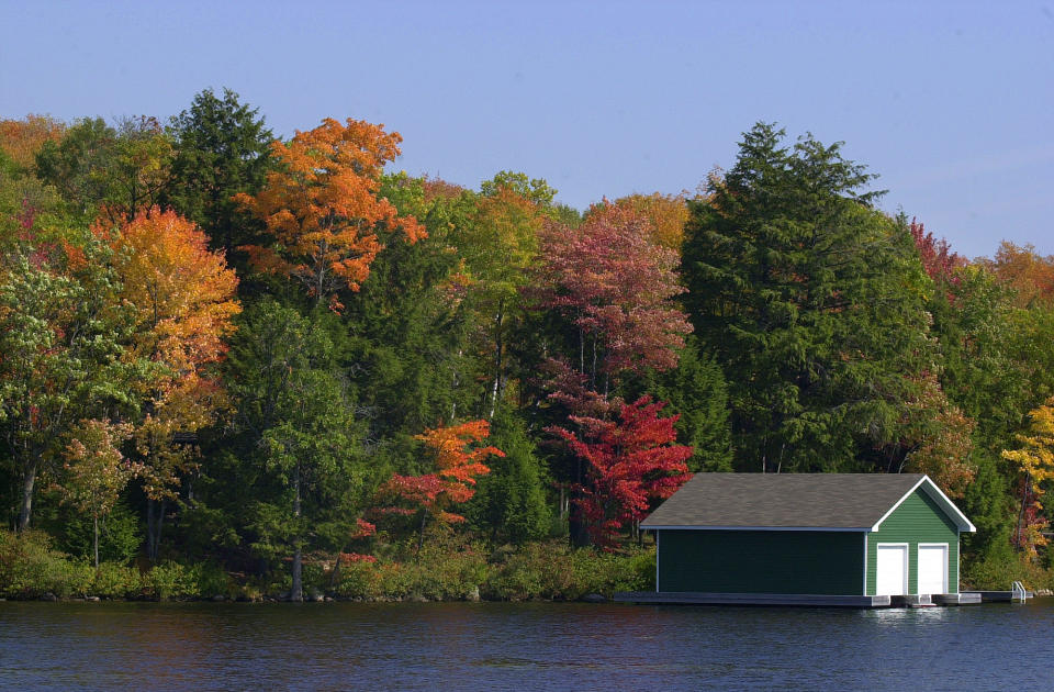 FALL COLORS.03.RPJ.,A boathouse sits nessled into the color of fall 2 Km from the town of Bala in Muskoka District, Ontario. For a photo story on the country colors for Saturday. ( RENE JOHNSTON /TORONTO STAR) (Photo by Rene Johnston/Toronto Star via Getty Images)