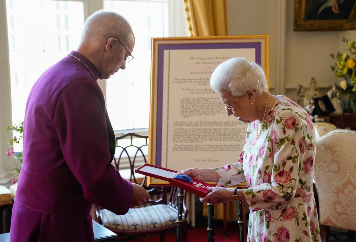 The Queen stood unaided after using a walking stick in recent months. (PA)