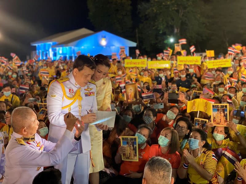 Thailand's King Maha Vajiralongkorn and Queen Suthida greet royalists at an airport in Udon Thani province