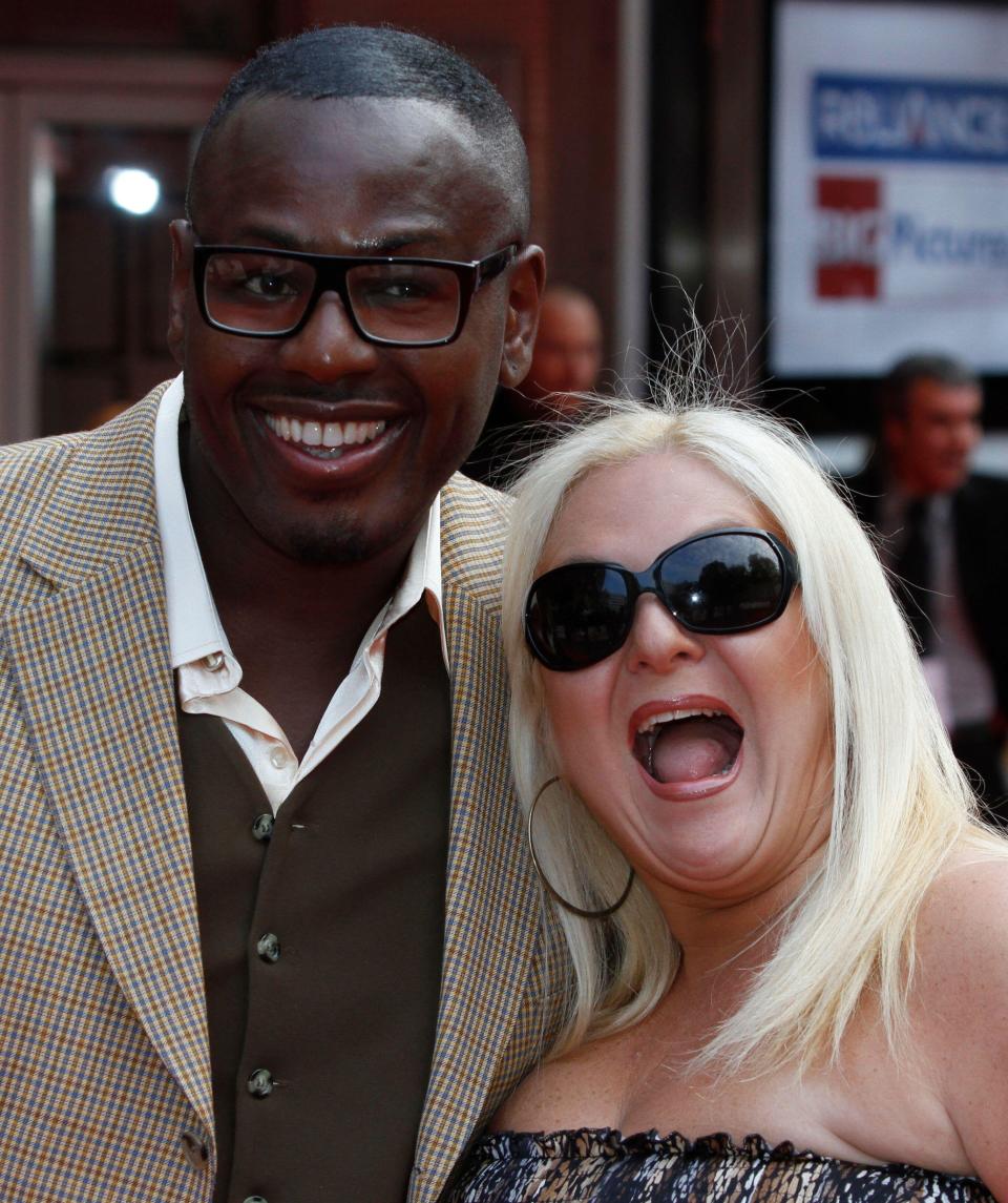 Vanessa Feltz, right, escorted by her partner Ben Ofoedu pose for the photographers as they arrive for the European film premiere of the film 'Kites', in a central London cinema, Tuesday, May 18, 2010. (AP Photo/Lefteris Pitarakis)