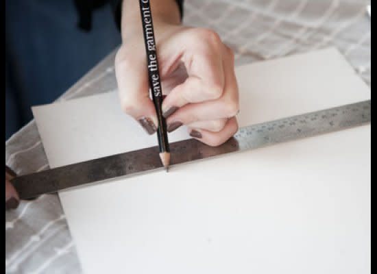 Measure a 10in x 10in square on cardboard (you can repurpose an old shirt box for this). Using the same material, measure four 10in x 1/2in rectangles for the outer rim and four 6in x 1/2in rectangles for the inner rim. 