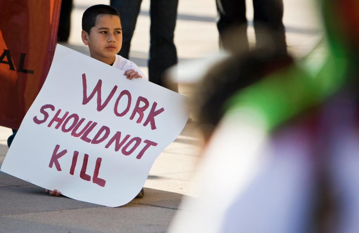 Sixto Jaimes, Jr. joined his father and about 500 construction workers and supporters who marched to the Texas State Capitol on March 2, 2011. They carried 138 coffins to signify the 138 construction workers who died on the job in Texas in 2009. (Credit: Ricardo B. Brazziell/ American-Statesman/File)