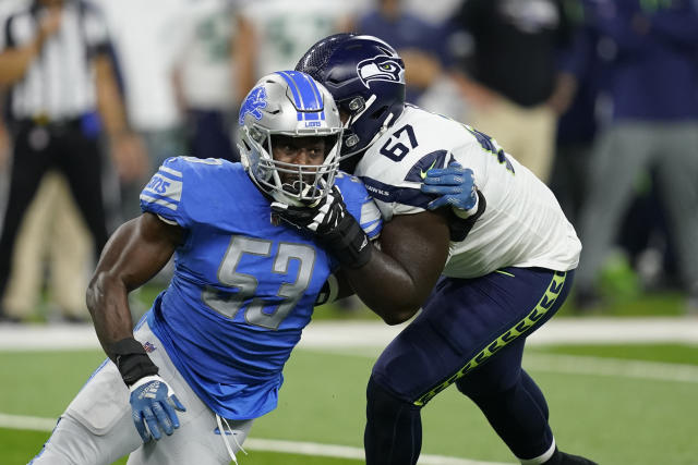 Seattle Seahawks tackle Charles Cross (67) warms up before playing against  the Los Angeles Rams in