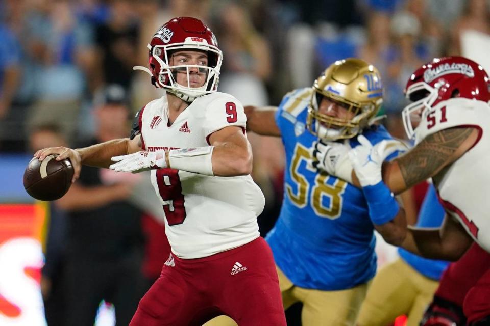 Fresno State quarterback Jake Haener led the Bulldogs to a 40-37 victory over UCLA at the Rose Bowl in 2021, their fourth victory in a row in the series. The teams have played 10 times, nine in Los Angeles and one in a bowl game. Marcio Jose Sanchez/AP file