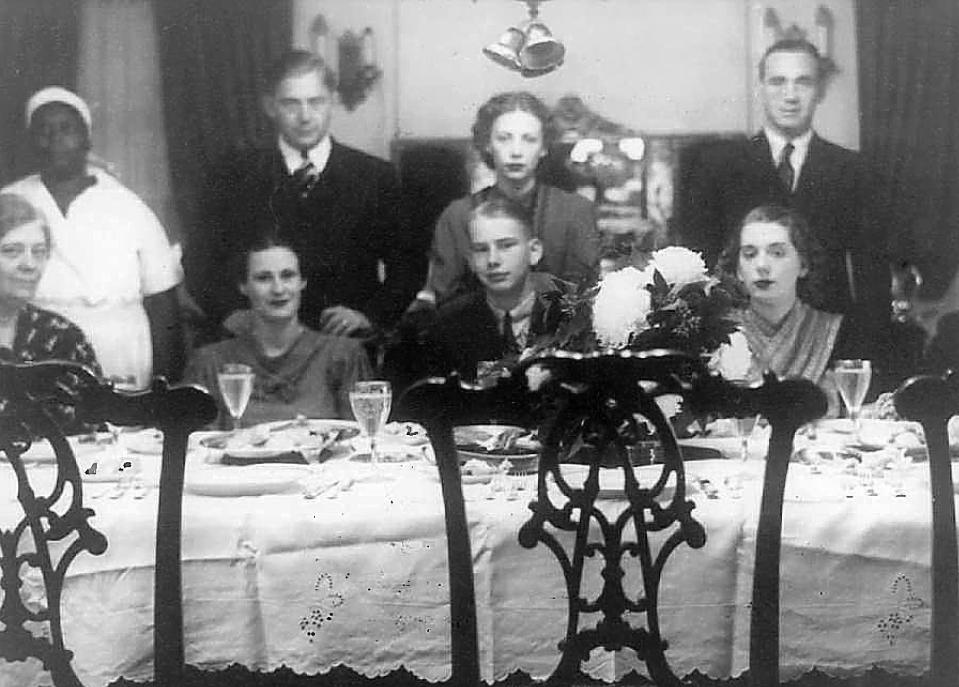 Eva Givens with the Jones family in their home.