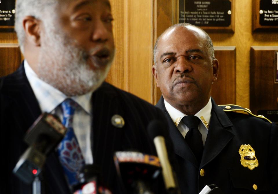 Shreveport Police Chief Wayne Smith listens to Caddo Parish District Attorney James Stewart during the press conference Wednesday, February 7, 2024 at the Shreveport Police Station.