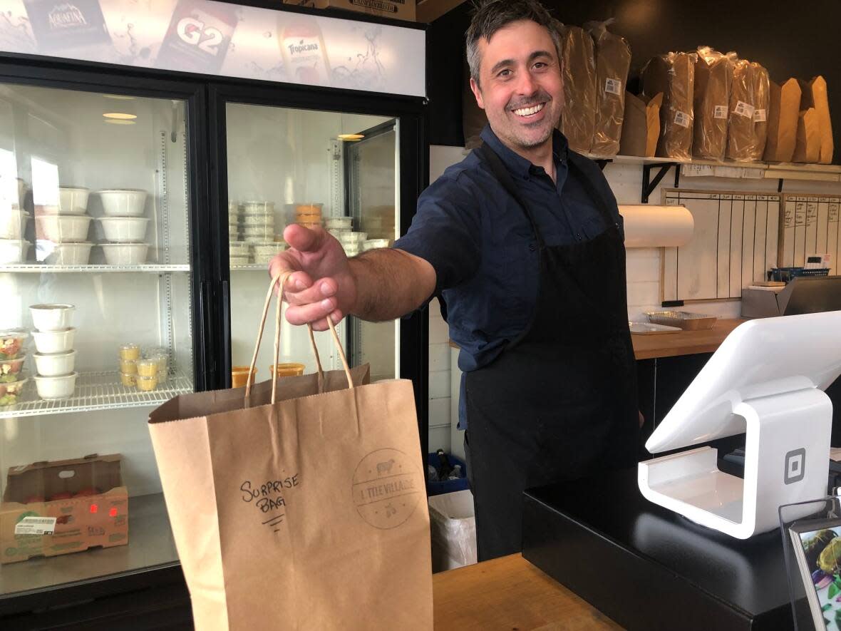 Theo Psalios owns Little Village, a Greek restaurant on Stony Plain Road. He signed up for Too Good To Go to help his restaurant cut back on food waste. (Clare Bonnyman/CBC - image credit)