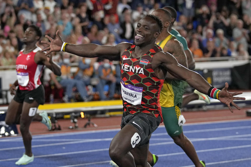 Kenya's Ferdinand Omanyala celebrates as he wins gold in the men's 100m final during the athletics in the Alexander Stadium at the Commonwealth Games in Birmingham, England, Wednesday, Aug. 3, 2022. (AP Photo/Alastair Grant)
