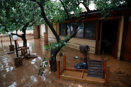 Meletis Rigos' house, is seen under flood waters following flash floods which hit the town of Magoula, Greece, June 27, 2018. REUTERS/Costas Baltas