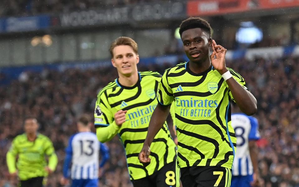 Bukayo Saka and Martin Odegaard celebrate Saka's goal