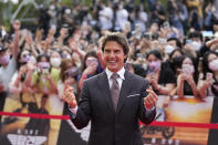 Tom Cruise gestures for photographers during the red carpet event to promote their latest movie Top Gun: Maverick in Seoul, South Korea, Sunday, June 19, 2022. The movie is to be released in the country on June 22. (AP Photo/Lee Jin-man)