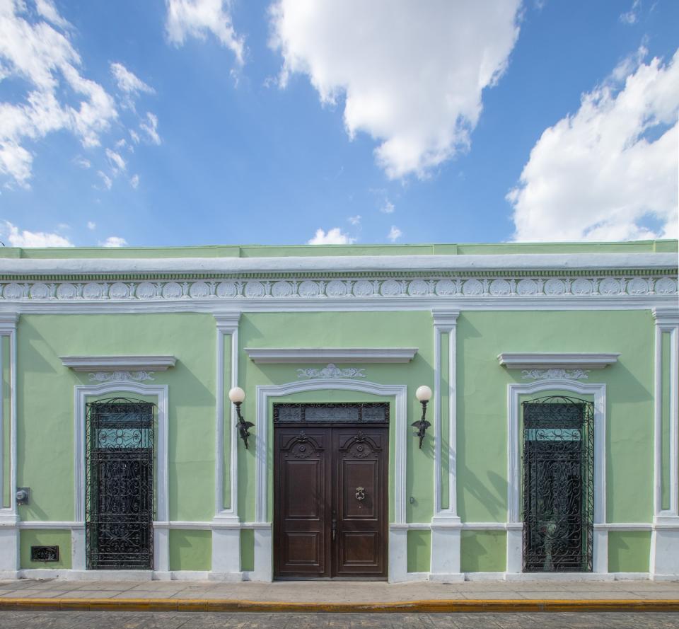 “This was once the grandest street in the city,” explains Skouras. “The façades are particularly beautiful, and I fell madly in love with this pistachio green one.”