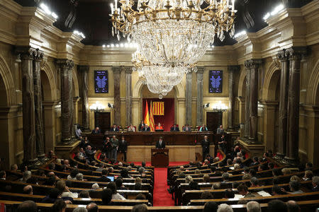 Catalan President Carles Puigdemont delivers a speech in the Catalan regional parliament in Barcelona, Spain, October 10, 2017. REUTERS/Albert Gea