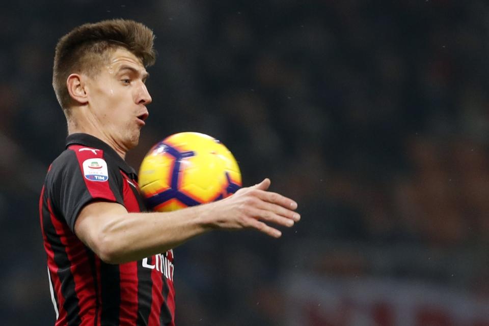 AC Milan's Krzysztof Piatek goes for the ball during the Serie A soccer match between AC Milan and Empoli, at the San Siro Stadium in Milan, Italy, Friday, Feb. 22, 2019. (AP Photo/Antonio Calanni)