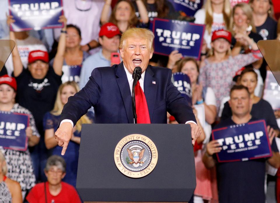 Donald Trump again used racist tropes in a renewed attack on four Democratic congresswomen at a campaign rally on Wednesday night, leading his supporters to chant "Send her back! Send her back!" in reference to the US citizen Ilhan Omar.The president used the North Carolina rally to resume his row with the self-styled "squad" of congresswomen that also includes Alexandria Ocasio-Cortez, and which began when he tweeted that the four should "go back" to their home countries.All four are people of colour and US citizens. Three were born in the US, while Ms Omar came to the country as a refugee from Somalia when she was 12.Referring to the women, Mr Trump said: "Tonight I have a suggestion for the hate-filled extremists who are constantly trying to tear our country down."They never have anything good to say. That's why I say, 'Hey if you don't like it, let 'em leave, let 'em leave'."Taking the politicians on one at a time, Mr Trump ticked through a list of what he deemed offensive comments by each woman, misconstruing many facts along the way. Ayanna Pressley of Massachusetts and Rashida Tlaib of Michigan complete the four.Ms Omar came under the harshest criticism as Mr Trump played to voters' grievances, drawing the sustained "send her back" chant.Before he left Washington, Mr Trump said he has no regrets about his ongoing row with the four. The president told reporters he's "winning the political argument" and "winning it by a lot"."If people want to leave our country, they can. If they don't want to love our country, if they don't want to fight for our country, they can (leave)," Mr Trump said. "I'll never change on that."His speech was filled with criticisms of the news media, which he says sides with liberals, and of special prosecutor Robert Mueller's Russia probe. Mr Mueller had been scheduled to testify to Congress on Wednesday, but it was postponed.He also talked about illegal immigration, a main theme of his first presidential bid that is taking centre stage in his re-election campaign.The president brushed off the criticism he has got for saying that the congresswomen should go back home. "So controversial," he said sarcastically.The four politicians say they are fighting for their priorities to lower health care costs and pass a Bill addressing climate change, while his attacks are a distraction and tear at the core of American values.The Democratic-led House of Representatives voted on Tuesday to condemn Mr Trump for what it labelled "racist comments", despite opposition from all bar four Republicans and the president's insistence that he does not have a "racist bone" in his body.The condemnation carries no legal repercussions and Mr Trump's latest harangues struck a chord with supporters in Greenville, who chanted "Four more years!" and "Build that wall!"It was Mr Trump's sixth visit to the state as president and his first 2020 campaign event in North Carolina, where he defeated Democratic nominee Hillary Clinton in 2016.Additional reporting by agencies