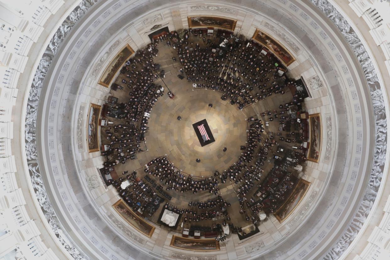 The casket of Sen. John McCain lies in state at the Capitol rotunda. (Photo: MORRY GASH/AFP/Getty Images)