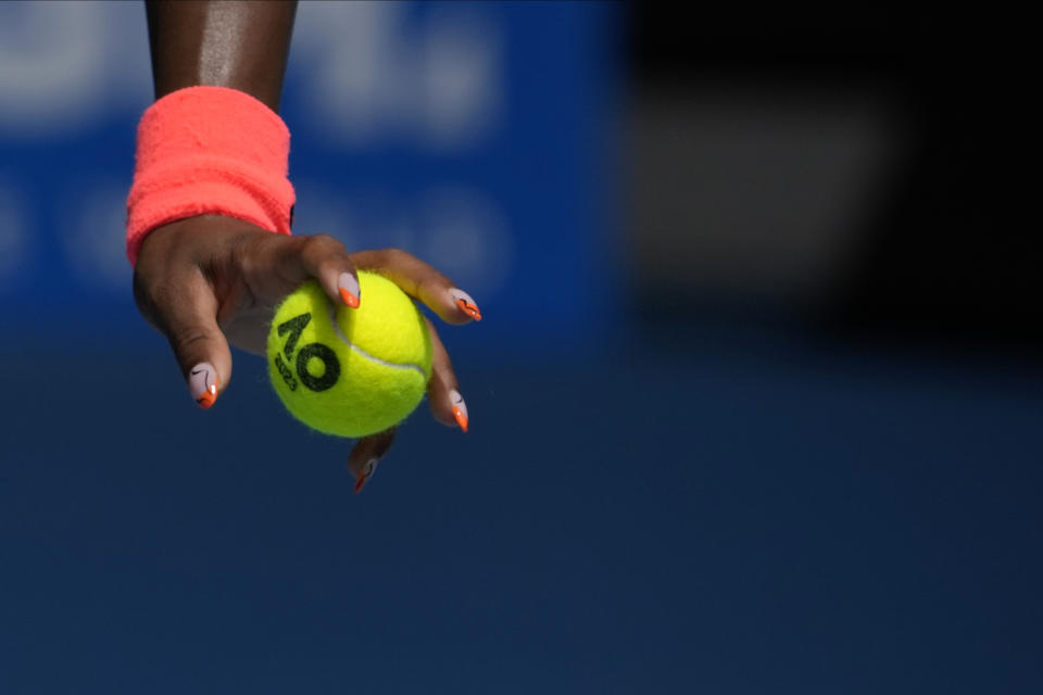 Coco Gauff of the U.S. prepares to serve to Katerina Siniakova of the Czech Republic during their first round match at the Australian Open tennis championship in Melbourne, Australia, Monday, Jan. 16, 2023. (AP Photo/Aaron Favila)