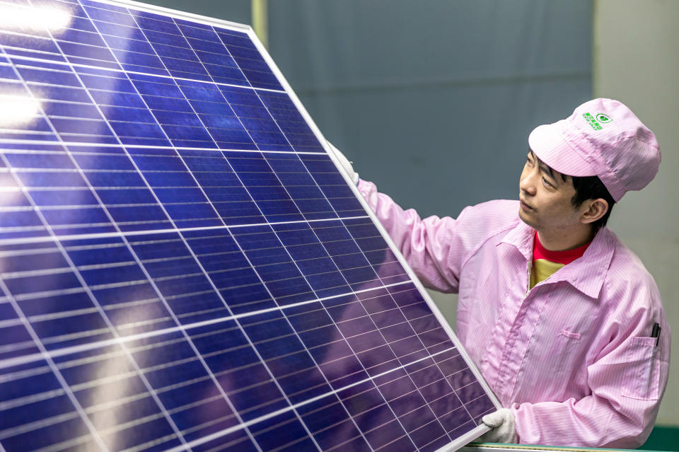 HAI&#39;AN, CHINA - APRIL 11: An employee works at a solar panel manufacturing workshop on April 11, 2021 in Hai&#39;an, Jiangsu Province of China. (Photo by Zhai Huiyong/VCG via Getty Images)