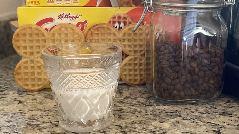 Half glass of creamer with Eggos