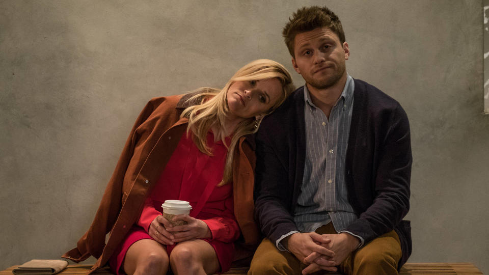 Alice sitting on a bench with Jon Rudnitsky as filmmaker George and leaning her head on his shoulder