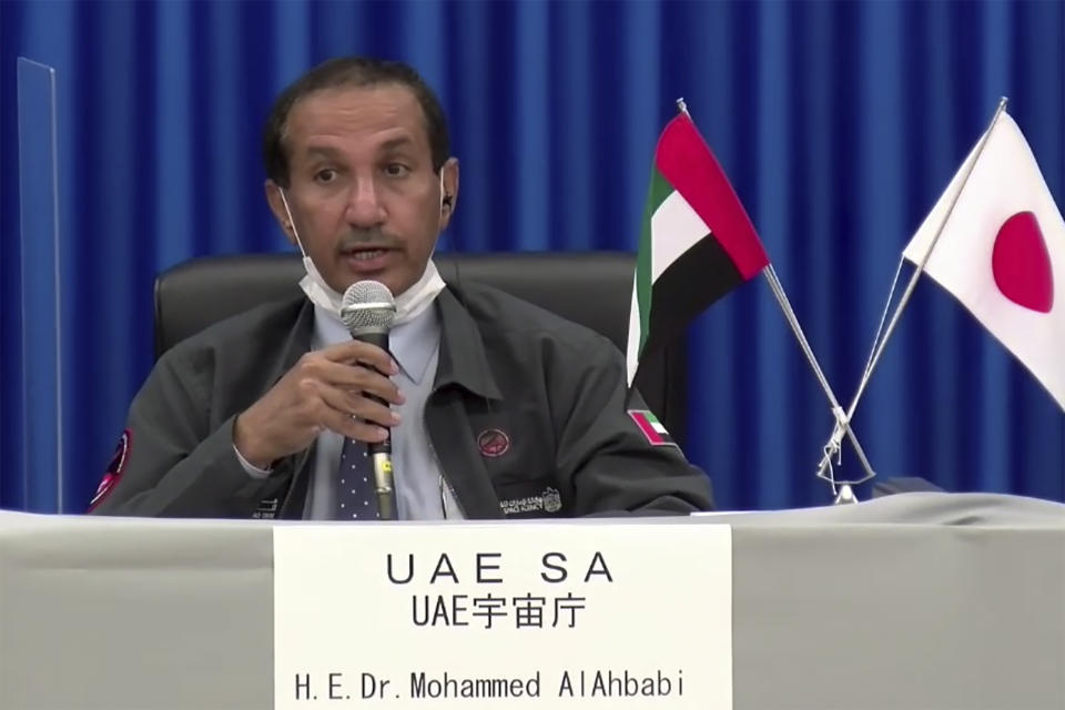 In this image made from a video, Mohammed AlAhbabi of UAE Space Agency attends a news conference at Tanegashima Space Center on a small southern Japanese island after a launch of a United Arab Emirates spacecraft Monday, July 20, 2020. A United Arab Emirates spacecraft rocketed away Monday on a seven-month journey to Mars, kicking off the Arab world’s first interplanetary mission. (MHI via AP Photo)