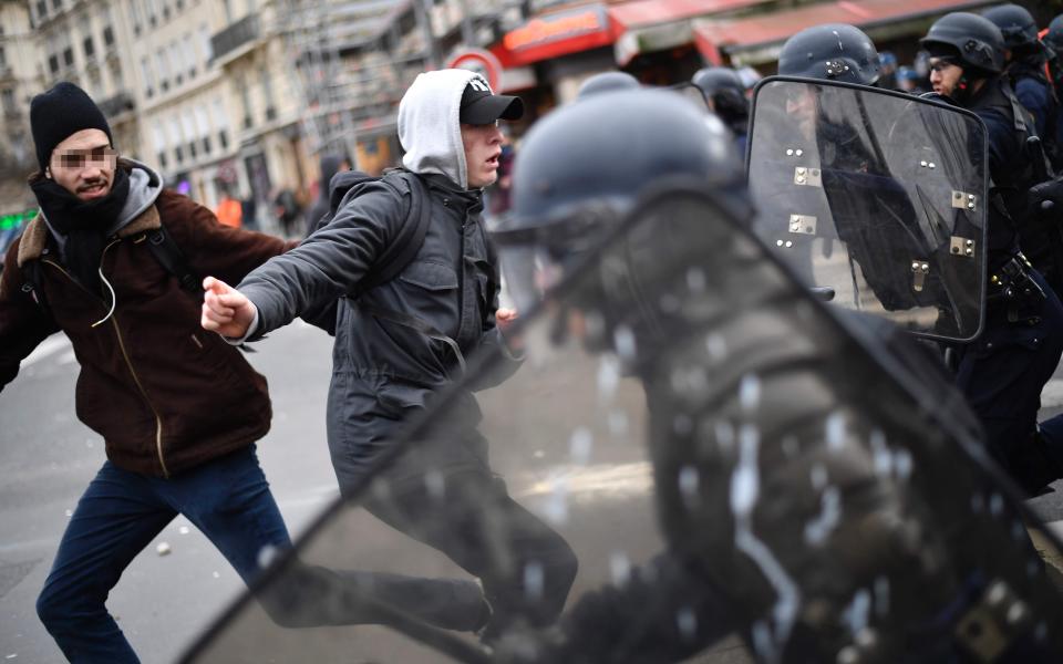 French youths clash with officers and blockade schools in protest over alleged police rape of black youth