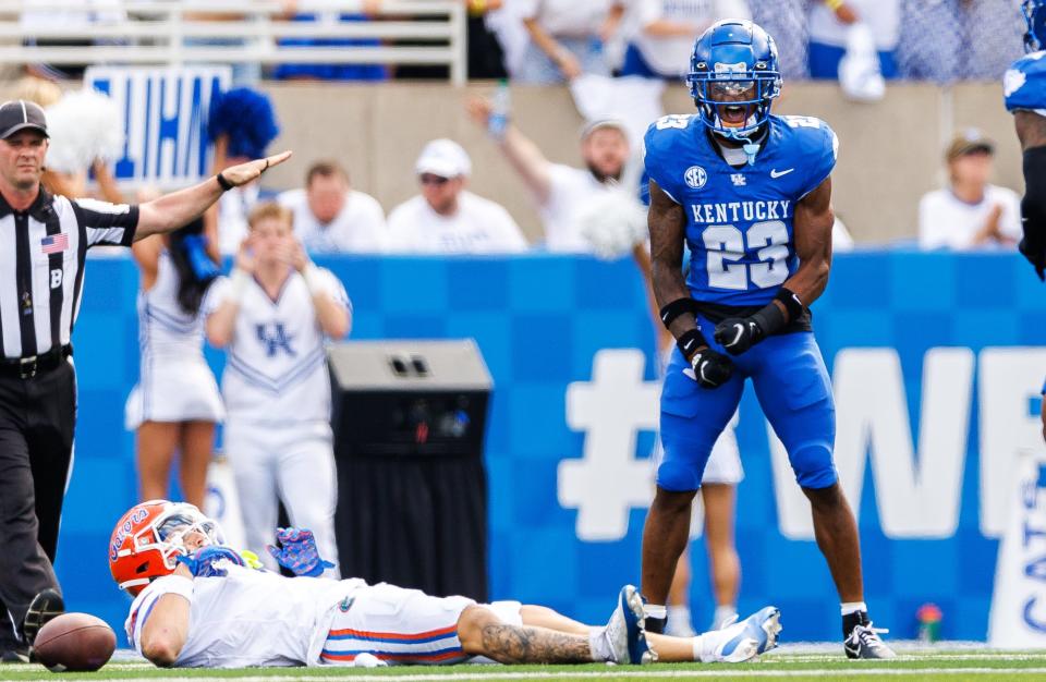 Sep 30, 2023; Lexington, Kentucky, USA; Kentucky Wildcats defensive back Andru Phillips (23) celebrates an incomplete pass intended for Florida Gators wide receiver Ricky Pearsall (1) during the second quarter at Kroger Field. Mandatory Credit: Jordan Prather-USA TODAY Sports