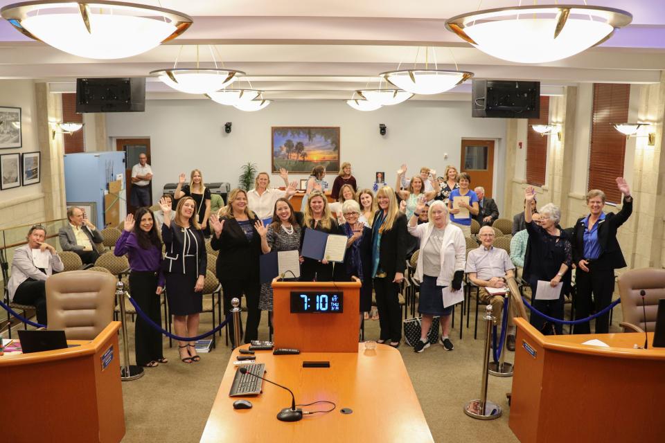 Council members stand among all of the women who attended the council meeting on March 14, 2024, in North Palm Beach during a historic meeting in which the council became entirely made up of women for the first time.