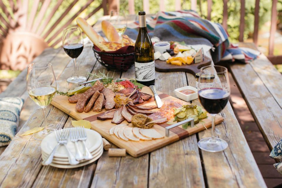 Meat and cheese boards with bottles of red wine from Page Springs Cellars