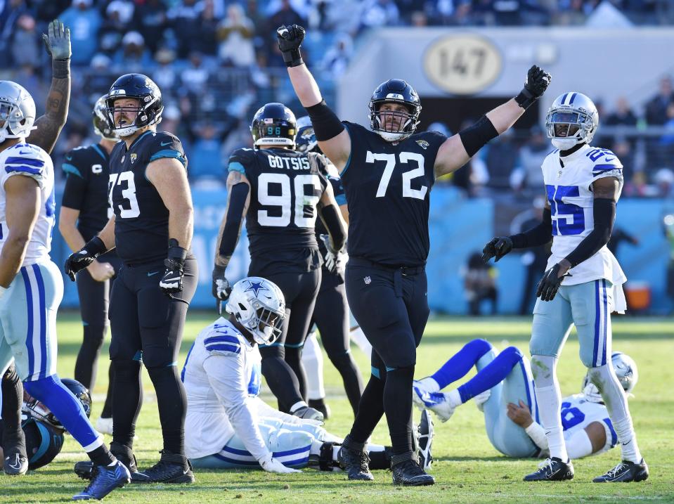 Jacksonville Jaguars offensive tackle Walker Little (72) celebrates after teammate place kicker Riley Patterson (10) kicked a field goal with 5 seconds on the clock to tie up the game and send it into overtime against the Cowboys. The Jacksonville Jaguars hosted the Dallas Cowboys at TIAA Bank Field Sunday, December 18, 2022. The Jaguars trailed 21 to 7 at the half but came back to win 40 to 34 with a pick six by Jacksonville Jaguars safety Rayshawn Jenkins (2) in overtime. [Bob Self/Florida Times-Union]