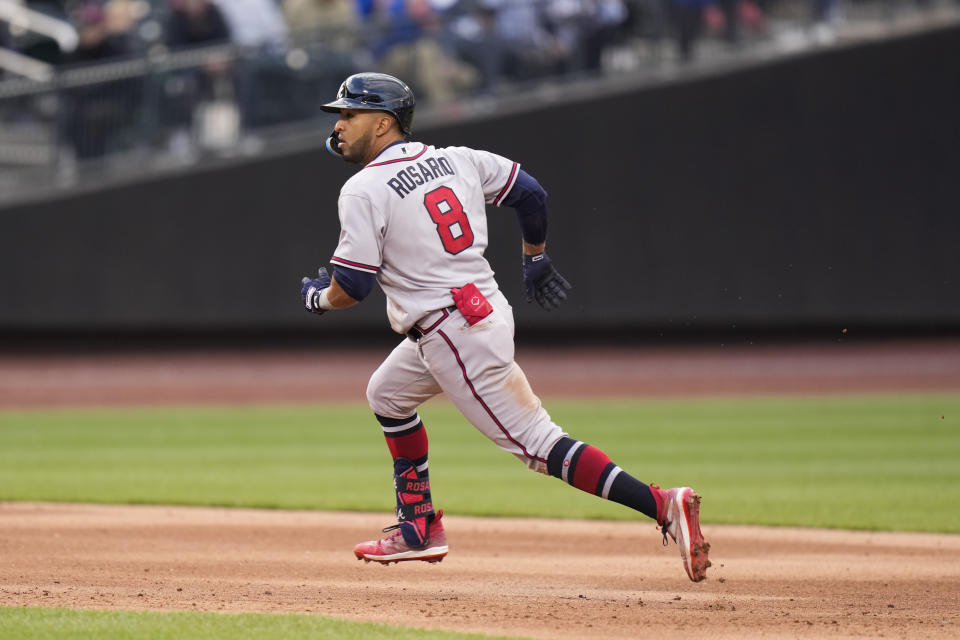 Atlanta Braves' Eddie Rosario runs around the bases after hitting a three-run double during the sixth inning of the second baseball game of a doubleheader against the New York Mets at Citi Field, Monday, May 1, 2023, in New York. (AP Photo/Seth Wenig)