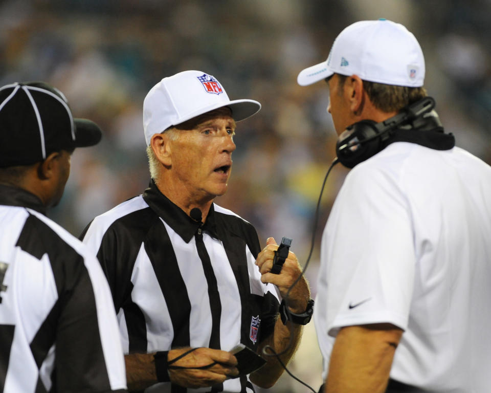 JACKSONVILLE, FL - AUGUST 10: Coach Mike Mularkey of the Jacksonville Jaguars questions replacement referee Jerry Hughes about a call during play against the New York Giants in a pre-season football game August 10, 2012 at EverBank Field in Jacksonville, Florida. The Jaguars won 32 - 31. (Photo by Al Messerschmidt/Getty Images)