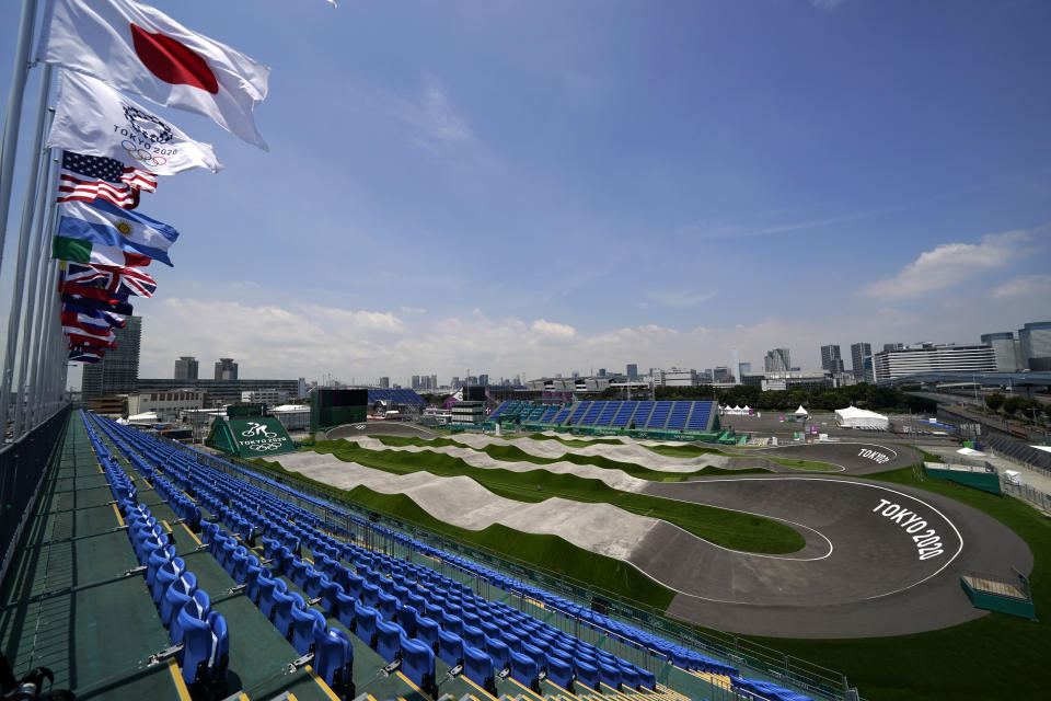 The BMX racing track is seen from the top of the grandstands as preparations continue for the 2020 Summer Olympics, Tuesday, July 20, 2021, at the Ariake Urban Sports Park in Tokyo. The pandemic-delayed games open on July 23 without spectators at most venues. (AP Photo/Charlie Riedel)