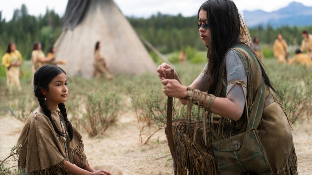  Amber Midthunder restrings Samiyah Crowfoot's bow in Prey. 