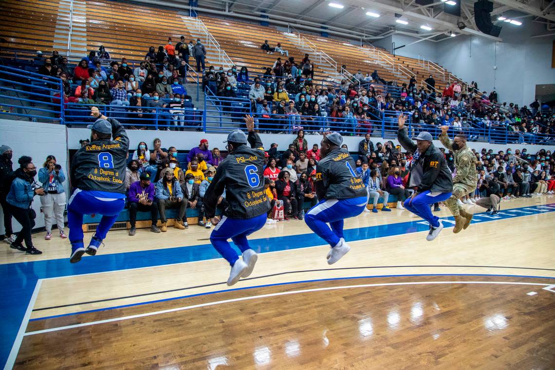 Members of s Fayetteville State University fraternity perform a step dance routine during Greek Night at a men’s basketball game against Livingstone at Fayetteville State Wednesday, Jan. 19, 2022.