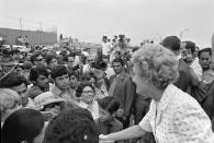 Then-first lady Pat Nixon greets people at the dedication of Friendship Park in San Diego and Tinjana, Mexico on Aug. 18, 1971. In the days before Joe Biden became president, construction crews worked quickly to finish Donald Trump's wall at an iconic cross-border park overlooking the Pacific Ocean that then-first lady Pat Nixon inaugurated in 1971 as symbol of international friendship. Biden on Wednesday, Jan. 20, 2021 ordered a "pause" on all wall construction within a week, one of 17 executive edicts issued on his first day in office, including six dealing with immigration. (Richard Nixon Presidential Library and Museum via AP)