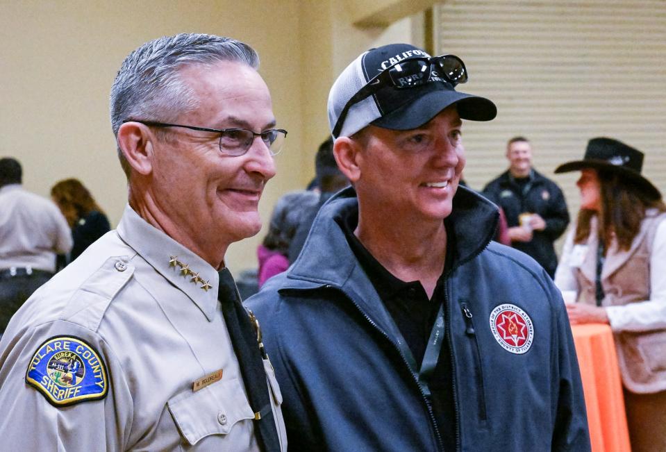 Tulare County Sheriff Mike Boudreaux, left, and Tulare County District Attorney Tim Ward pose for pictures during World Ag Expo 2022 opening ceremonies on Tuesday, February 8.