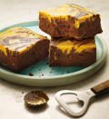 <i>By Matthew Kadey</i> <b>INGREDIENTS</b> 2 tbs low-fat cream cheese, room temperature ½ cup plus ¼ cup sugar ½ cup canned pumpkin (available from David Jones) or cooked, pureed pumpkin 3 large eggs, room temperature 1 cup plus 2 tbs wholemeal plain flour 1 tsp cinnamon, divided 170g cooking chocolate, chopped 2 tbs unsalted butter ⅓ cup unsweetened cocoa powder 1 cup stout beer, room temperature 1 tsp vanilla extract ½ tsp baking powder ¼ tsp cayenne powder (optional) ¼ teaspoon salt 1 Preheat oven to 175°C. Lightly grease a 20-centimetre square baking pan. In a bowl, stir together cream cheese, ¼ cup sugar, pumpkin, one egg, two tablespoons flour and ½ teaspoon cinnamon, then set aside. 2 Place chocolate and butter in a metal bowl and heat over a pot of simmering water, stirring until completely melted. Remove the mixture from the heat and stir in ½ cup sugar. Mix in two eggs, one at a time. Gently stir in one cup flour, cocoa powder, beer, vanilla extract, baking powder, cayenne, salt and ½ teaspoon cinnamon. 3 Scrape half the chocolate batter into the prepared baking pan and spread evenly. Spread half the pumpkin mixture on top, then add the remaining chocolate mixture on top of that and spread evenly. Top with the remaining pumpkin mixture. Gently swirl batter with a butter knife. Bake for about 30 minutes, or until an inserted toothpick comes out clean. Let cool before slicing. <i>Makes 4 servings Per brownie: 669kJ, 8g fat (4g sat), 23g carbs, 75mg sodium, 3g fibre, 3g protein</i>