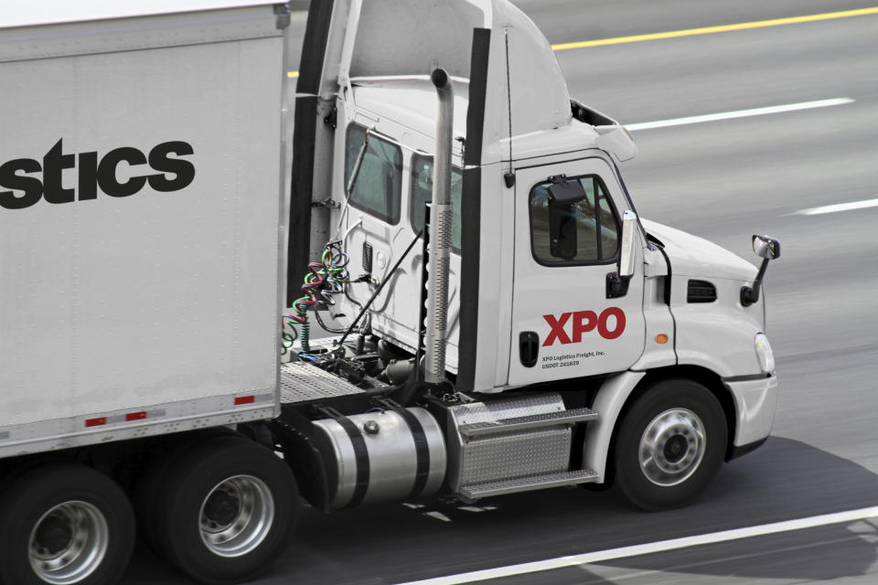 Semi-trailer truck with XPO logo on it on a highway