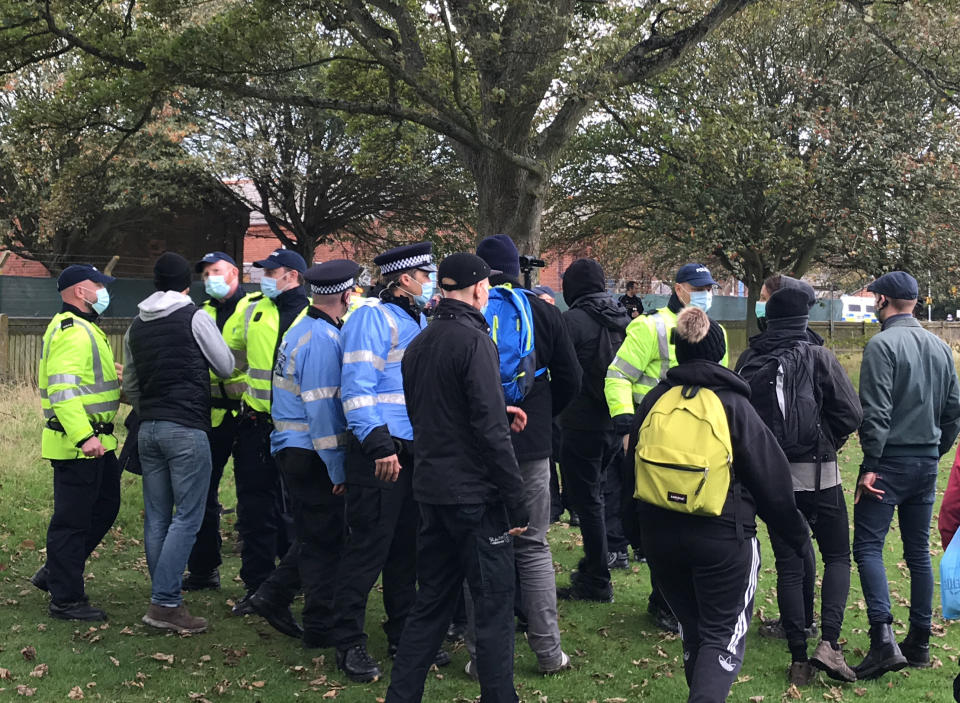 Police intervene and remove a man during a demonstration outside Napier Barracks in Folkestone, Kent, where pro-migrant supporters have gathered to welcome migrants to the area. The barracks has been converted to house around 400 asylum seekers, many of whom have crossed the Channel by boat.