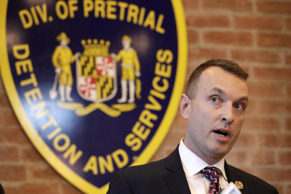 Maryland Assistant State Attorney Patrick Seidel speaks during a news conference announcing the indictment of correctional officers, Tuesday, Dec. 3, 2019, in Baltimore. Twenty five correction officers, most of whom were taken into custody earlier in the day, are charged with using excessive force on detainees at state-operated Baltimore pretrial correctional facilities. (AP Photo/Julio Cortez)