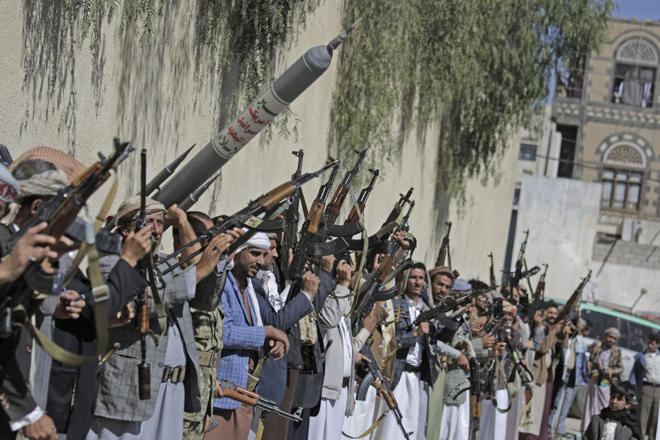 Tribesmen loyal to the Houthi rebels chant slogans as they hold their weapons during a gathering aimed at mobilizing more fighters for the Houthi movement in Sanaa, Yemen, Tuesday, Feb. 25, 2020. (AP Photo/Hani Mohammed)