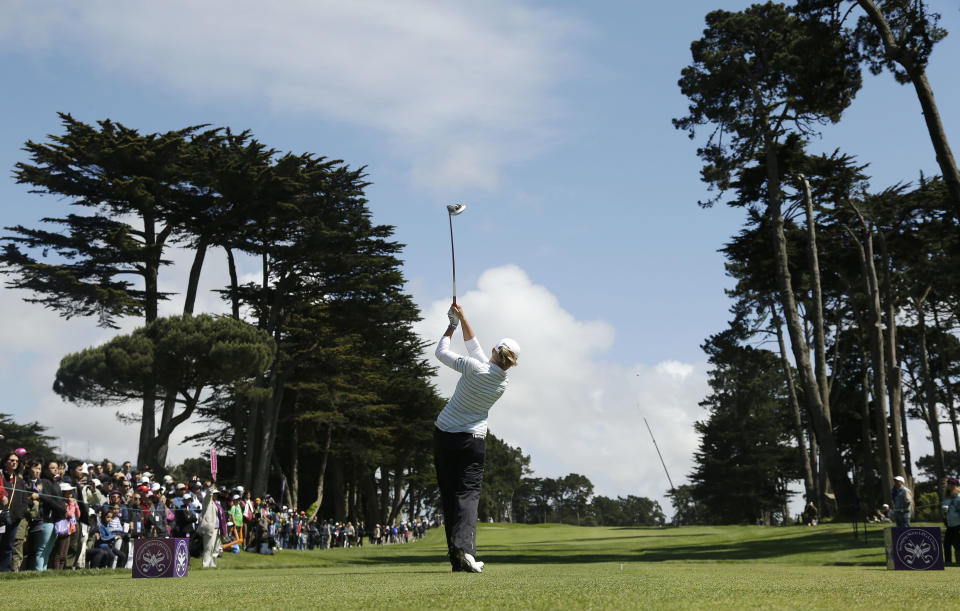 Stacy Lewis follows her drive from the sixth tee of Lake Merced Golf Club during the final round of the Swinging Skirts LPGA Classic golf tournament on Sunday, April 27, 2014, in Daly City, Calif. (AP Photo/Eric Risberg)