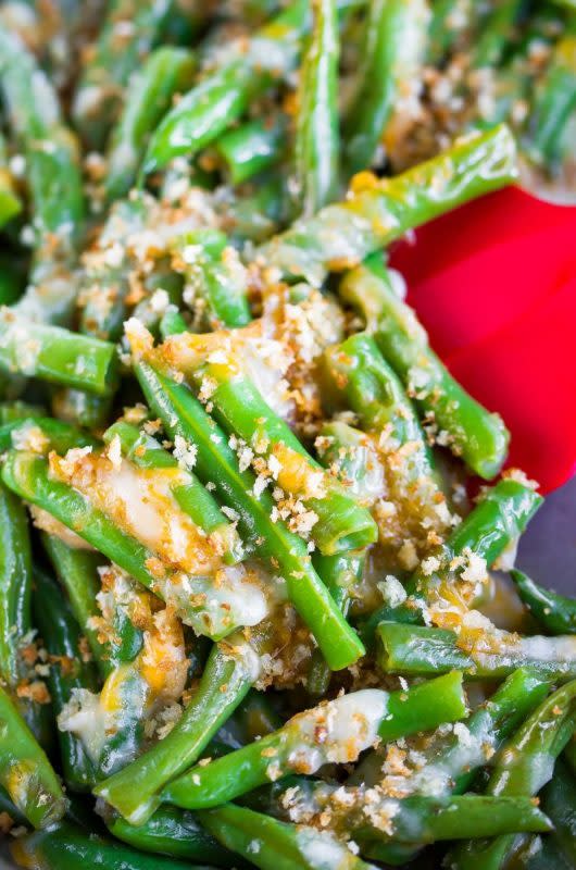 <p>Courtesy of peasandcrayons.com</p><p>These cheesy green beans are a quick, easy, and totally delicious side dish—you can use a combo of cheddar and mozzarella, or any other cheese you love.</p><p><strong>Get the recipe: <a href="https://peasandcrayons.com/2018/11/cheesy-green-beans.html" rel="nofollow noopener" target="_blank" data-ylk="slk:Cheesy Green Beans;elm:context_link;itc:0;sec:content-canvas" class="link rapid-noclick-resp">Cheesy Green Beans</a></strong></p>