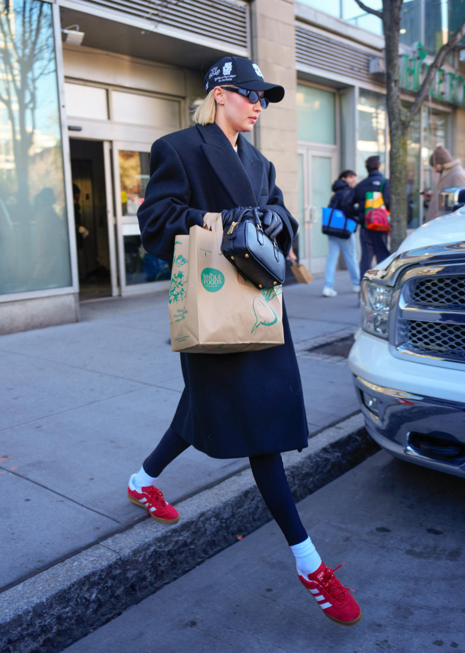 Gigi Hadid Adds a Pop of Red to Wintry Neutrals While Out in NYC