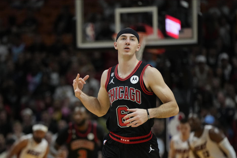 Chicago Bulls guard Alex Caruso (6) celebrates after a basket during the first half of an NBA basketball play-in tournament game against the Miami Heat, Friday, April 14, 2023, in Miami. (AP Photo/Rebecca Blackwell)