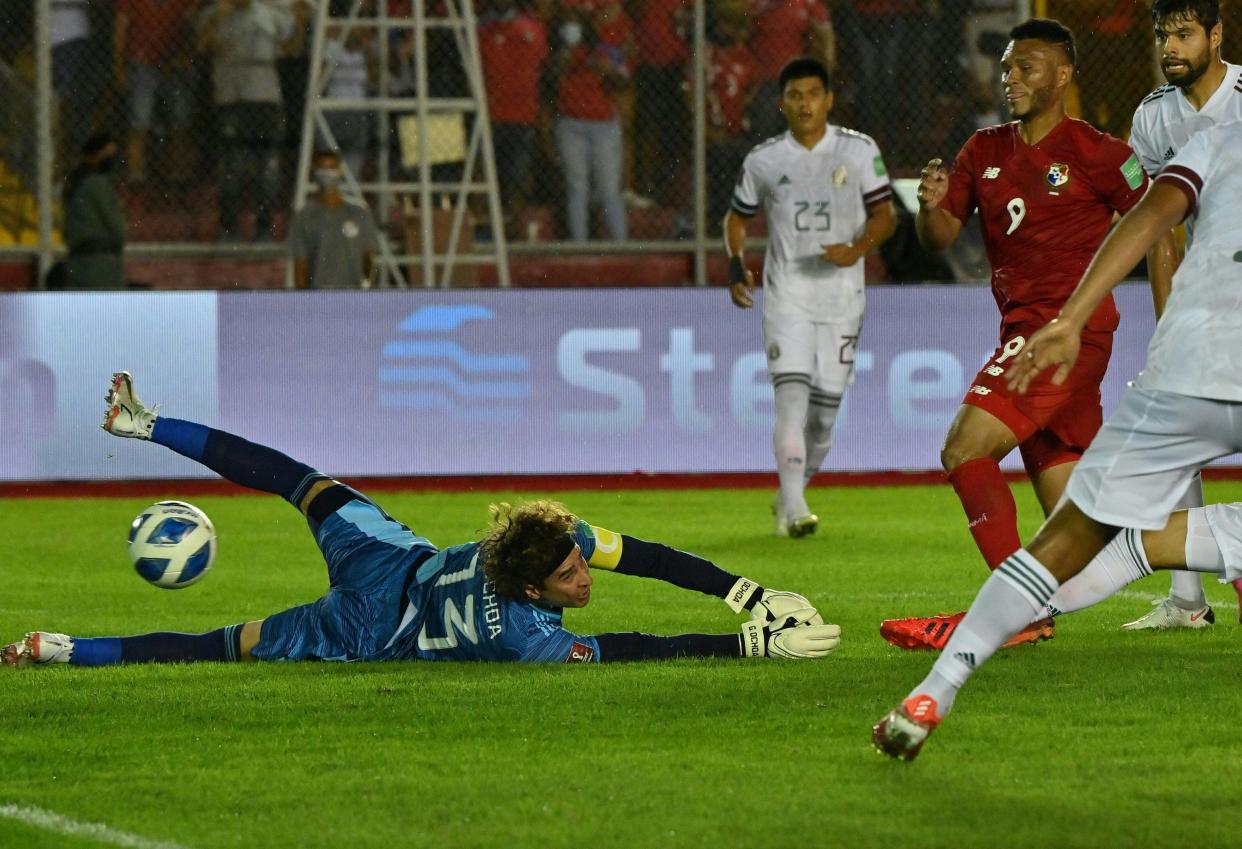 Panama's Rolando Blackburn (R) scores a goal against Mexico's goalkeeper Guillermo Ochoa during their Qatar 2022 FIFA World Cup Concacaf qualifier match at the Rommel Fernandez stadium in Panama City, on September 8, 2021. (Photo by Luis ACOSTA / AFP) (Photo by LUIS ACOSTA/AFP via Getty Images)