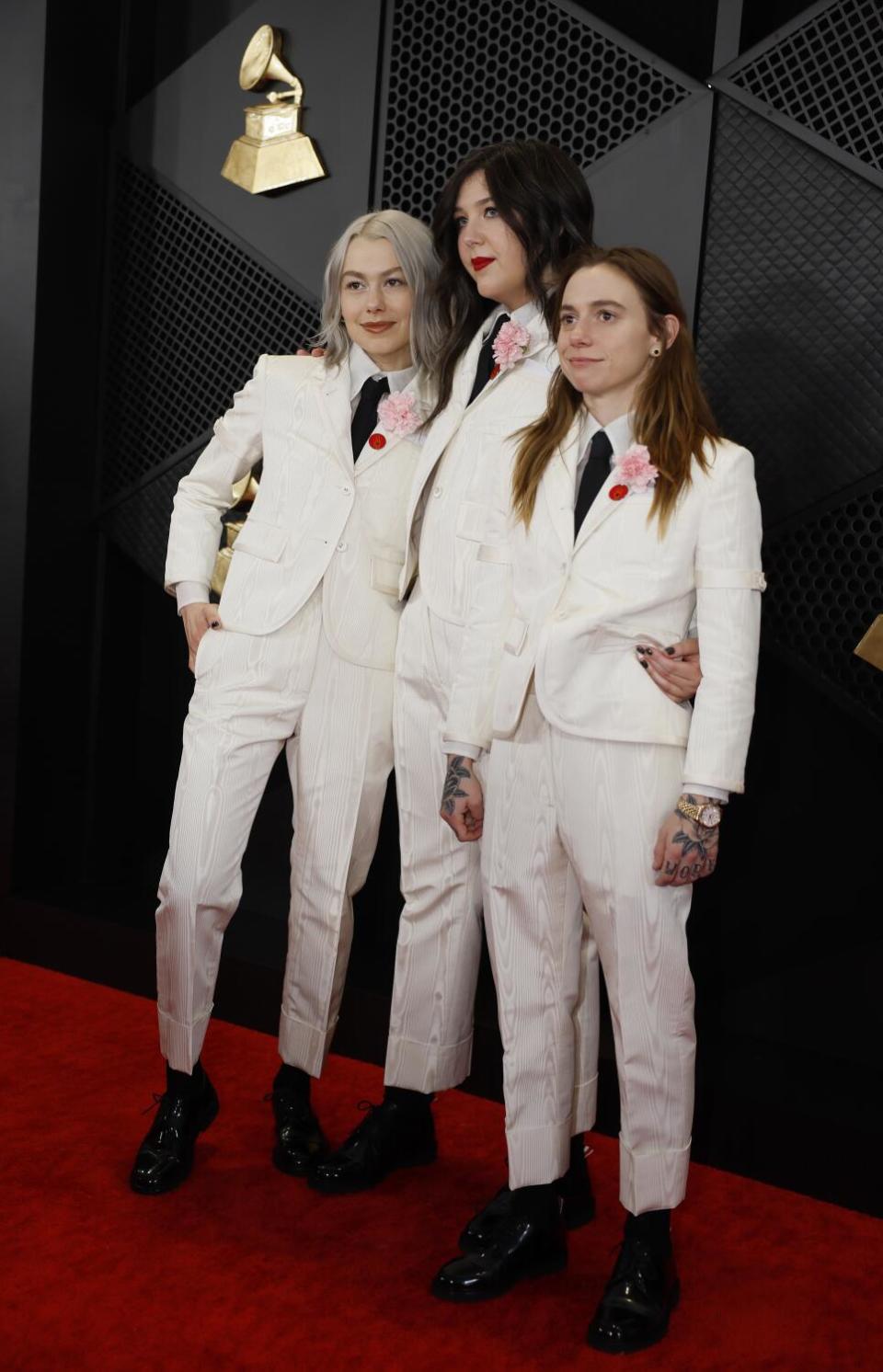 Boygenius' Phoebe Bridgers, Lucy Dacus and Julien Baker in white suits with black ties