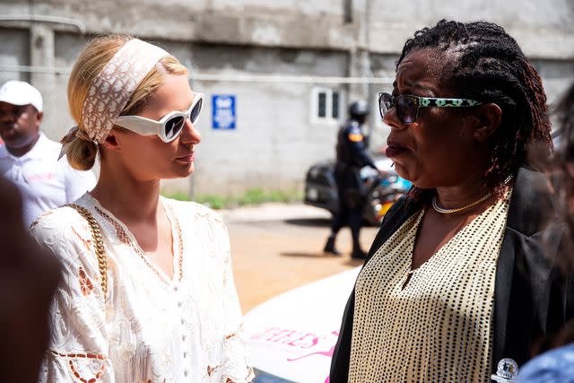 <p>Courtesy of 11:11 Media Impact</p> Paris Hilton converses with the impacted at Treasure Beach, Jamaica press conference